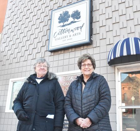 Village Square members, from left, Dorothy Balaban and Loretta Jost stand in front of the former location of Cottonwood Gallery. The retail cooperative will be moving from its location to the previous gallery space at the end of February. Moving members Joyce Dose, Becky Freelend and Janet Alberts are not pictured.