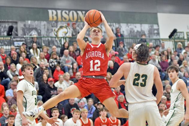Carsen Staehr does a his best Michael Jordan impression through the lane short of a slam dunk during Aurora’s 35-24 loss to Central City in the C1-8 subdistrict final Thursday. 