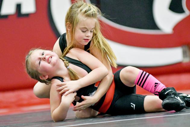 Embree Keasling looks for a potential pin against fellow Aurora club member Elsie Bates in their showdown Friday.