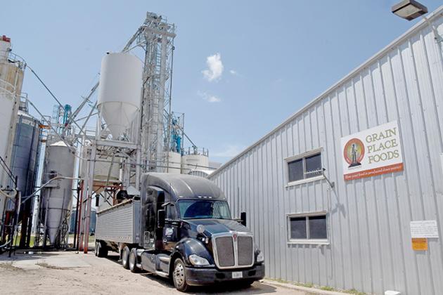 A truck unloads organic grain at the Grain Place Foods elevator. Tours of the farm and processing facilities will be included as part of the 30th annual Field Day scheduled for Saturday, July 15. 