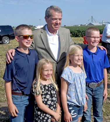 Gov. Jim Pillen took time to interact with some potential future Nebraska farmers at the recent Mission Critical groundbreaking. Pictured with the governor are Sawyer, Josie, Sadie and Jackson Sauder of Imperial. 