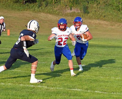 HPC's Wyatt Urkoski carries the football with teammate Gage Friesen out front in HPC's 56-6 loss to Central Valley Thursday. 
