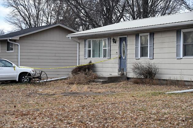 Yellow police tape remained tied to the front door Monday morning at this house on Fairview Drive in Aurora, the site of Saturday’s triple stabbing.