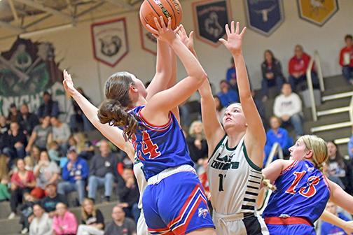 High Plains junior Rylee Ackerson finds a bit of space in the lane during the Storm’s first-ever district final Friday. This year’s HPC girls set several records, including season wins (16). 