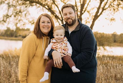 Lindsay (Hattan) Gould, seen here with her husband, Matthew and her 2-year-old daughter Josie, currently works at Nebraska Children’s Hospital in Informational Technology. 
