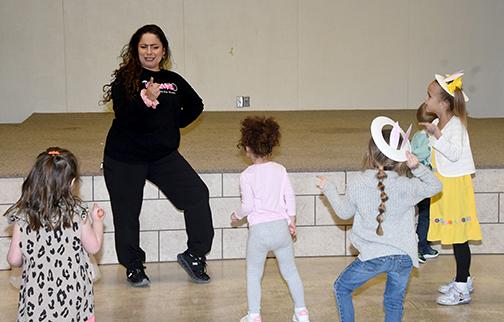 Ashley Parker gets her groove on with several youngsters at the Tempo Dance Studio event Saturday. 