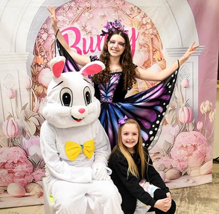 The Easter Bunny poses for a photo with Olivia Bangs, center, and Tatum Stevens Saturday morning as Tempo Performing Arts Studio hosted a fundraising event to provide scholarships enabling more kids and families to participate.