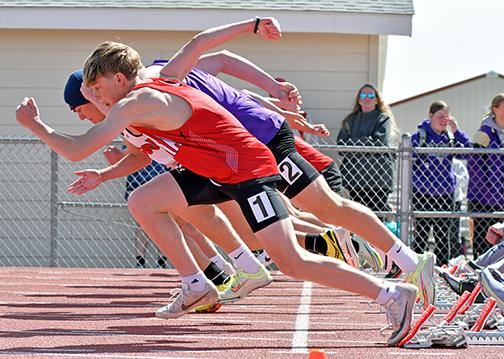 Aurora’s Isaiah Uhrmacher explodes out of the blocks from lane one during one of several 100 meter dash preliminaries at Thursday’s Gothenburg Dutch Zorn Invite. 