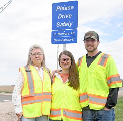Pictured from left at last week’s sign dedication honoring the late Dave Schwartz are his wife, Liz, and children Shelbi Bates and Matthew Schwartz.