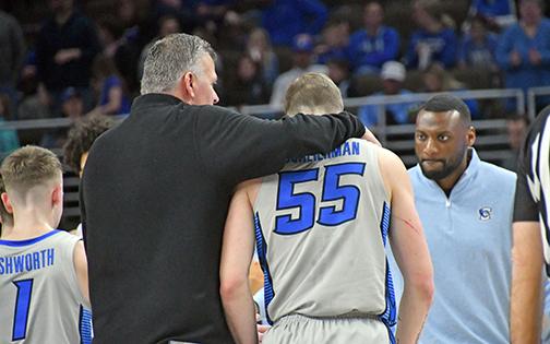 During a Creighton home game earlier this season, Bluejay coach Greg McDermott puts his arm around Baylor Scheierman as they head for the locker room at halftime. 