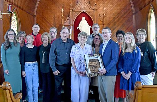Elna Johnson, front center, is surrounded by members of her immediate and extended family, all of whom are descendants of Niels and Anna Marie Andersen.  Johnson and her children -- Brenda, Randy, Lori and Kurt -- presented the family’s Danish Bible back to St. John’s Lutheran Church during a ceremony April 21 at the church in Kronborg.