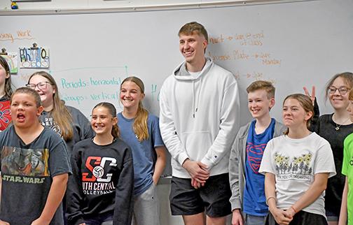 Former Husky and NBA hopeful Baylor Scheierman posed with several middle school classes after sharing his motivational message Friday afternoon. 