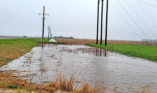 The ditch on the west side of Highway 14 near the electrical substation north of Aurora stands full of water Friday morning, a result of overnight storms. 