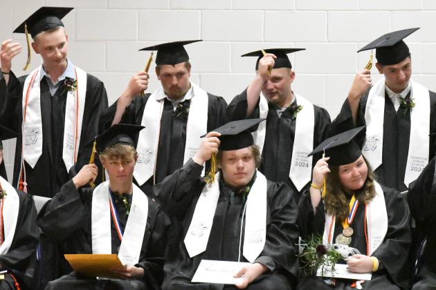 After receiving their diplomas on Saturday afternoon, members of the Hampton High School Class of 2024 move their tassels from right to left. Seated, from left, are Grant Ferguson, Hayden Farris and Valedictorian Dani Dowling. Standing are Sam Wishman, Korbin Stump, Evan Pankoke and Trey Moellenberndt-Kleier. 
