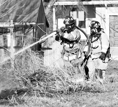 Aurora firefighters are shown here responding to a call earlier this year. News-Register file art