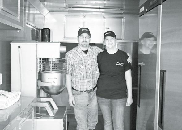 Andrea Winfield, who purchased the Aurora Meat Block with her husband Brent in 2014, is now launching a new culinary business based out of this new 8 1/2x20 foot food trailer. News-Register/Cheyenne Rowe
