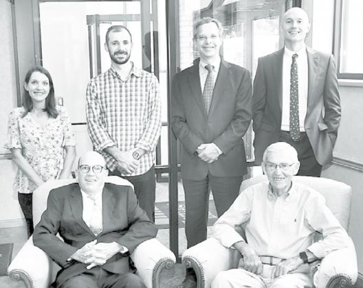 Pictured are members of the new and old guard of the Farr Trust. Seated from left are Sam Moyer and Jim Koepke. Back from left are Emily Jasnowski, Brett Mitchell, Steve Arnett and Jacob Arendt. News-Register/Kurt Johnson