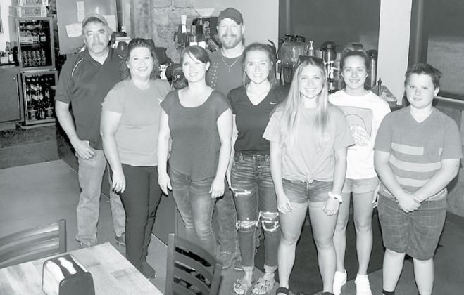 Pictured from left are Jim and Marni Danhauer, owners of JoJo’s Gelato, along with Coasters Coffee Co. owners Sara and Aaron Johnson, shown with their children Cora, Felicity, Isabel and Truitt. News-Register/Kurt Johnson