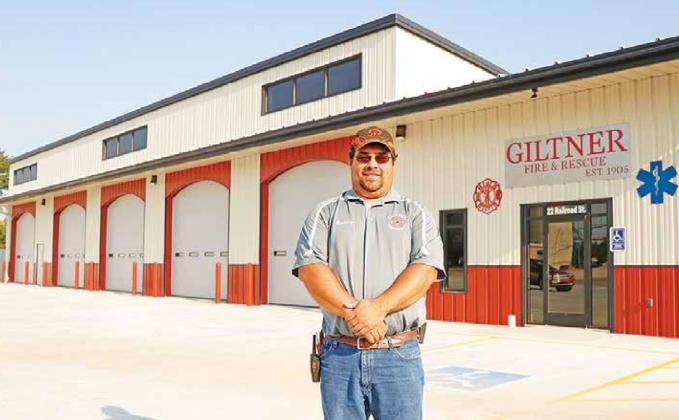 Giltner Fire Chief Brad Consbruck stands proudly in front of the community’s new five-bay fire barn. The crew has already run a call from the new space and enjoys all the room it provides. News-Register/Cheyenne Rowe