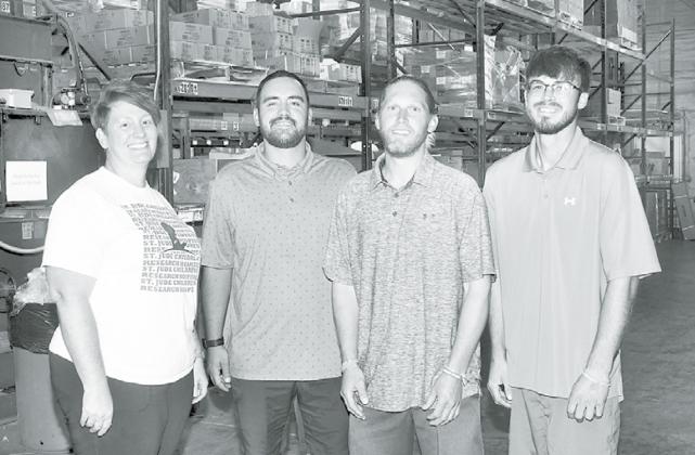 Pictured from left are the new owners of 1st Web Sales in Aurora, including Sara Straight, Cy Friesen, Cy Carlson and Josh Schaffert. All four are long-time employees of the e-commerce company. News-Register/Kurt Johnson