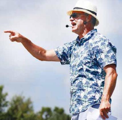 Not one to miss out on the action of a themed band camp day, instructor Dan Sodomka sported a festive Hawaiian shirt while giving his band pointers. News-Register/Cheyenne Rowe