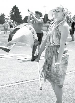 Aurora senior Bailey Howland completed her band camp look with a grass skirt. She returns for another year as part of the color guard. News-Register/Cheyenne Rowe