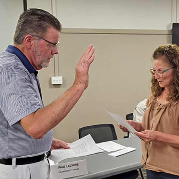Aurora businessman Todd Jensen takes the oath of office to become a city councilman representing Ward 1