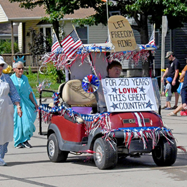 This entry in Sunday’s Booster Days Parade in Hampton won the prize for Best Theme with its America 250-themed costumes and decorations. From left above are Sharon Klute as U.S. Flag Creator Betsy Ross, Damaris Olsen as the Statue of Liberty, Jean Anne Schmidt as Miss USA and Loa Winter as Uncle Sam.