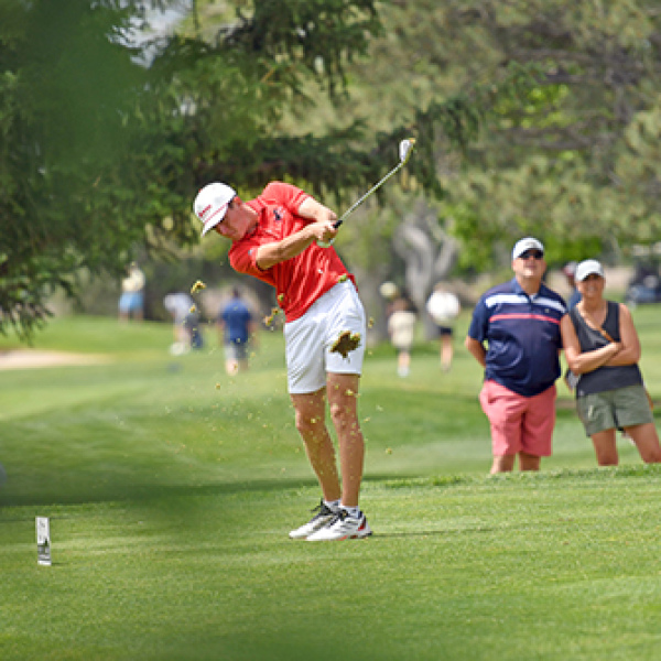 Ryan Staehr takes a chunky divot off the par-3 17th hole during Thursday’s second round of the Class B state golf tournament at Scottsbluff Country Club. Staehr turned in rounds of 86 and 88 for a two-day score of 174. 