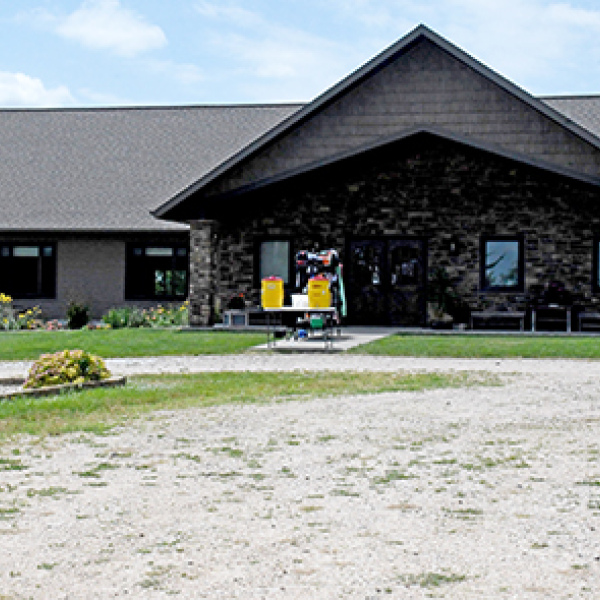 The original lodge building at CRC was replaced by this new one 12 years ago, which has given the facility more room for indoor activities on hot summer days. A rack with the campers’ lunch bags stands out front. 