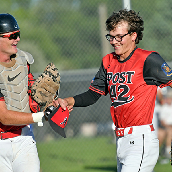 ukas Fry (right) and Dylan Ronnau share a laugh coming off the field during a game earlier this season. Fry has pitched 18 innings this season for the Pinnacle Bank Seniors, the most on the team. 
