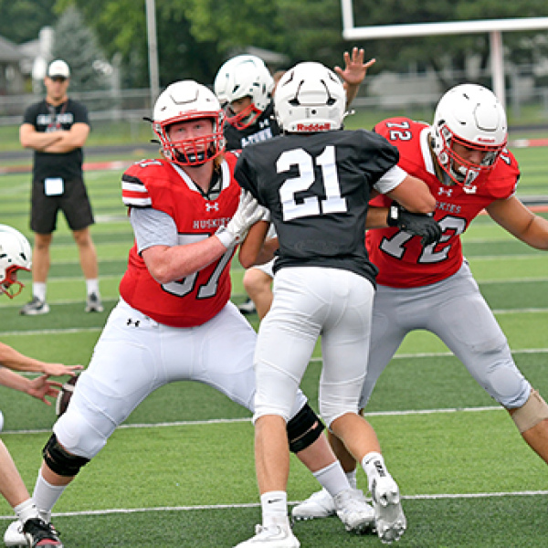Gabe Gibson (57) and Tucker Theriot (72) work on extra point protection.