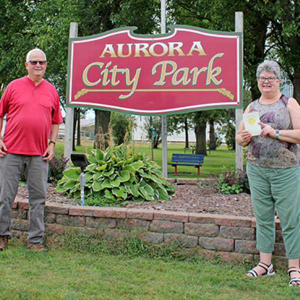 The first stop on Tom and Patti Kell’s trip in the fall of 2025 to visit towns named Aurora was Aurora, S.D., where they had this picture taken of them at the city park. South Dakota’s Aurora is near Brookings and close to the Minnesota border. 
