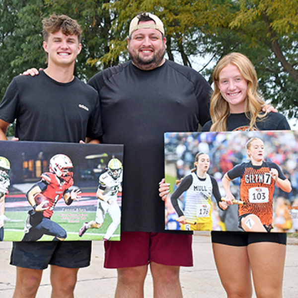 Aurora’s Canon Allen (left) and Giltner’s Avery Reeson were selected as the Aurora News-Register’s athletes of the year for the 2024-25 sports season. Allen and Reeson pose for a photo with ANR sports editor Richard Rhoden. 