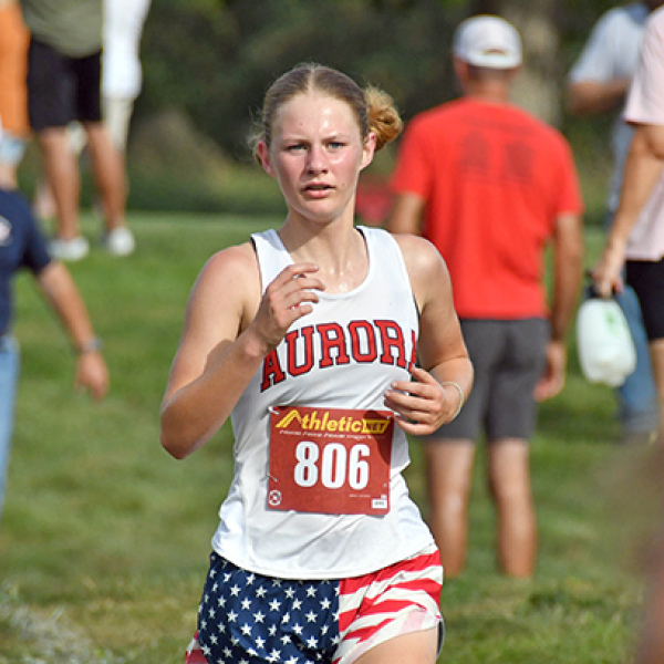 Kailey Dick ran her first race of the season at the Aurora Invite with renewed strength an a finish of 18th with a time of 22:36. Aurora runners wore American Flag shorts in celebration of America 250 and in remembrance for the 25th anniversary of 9/11.