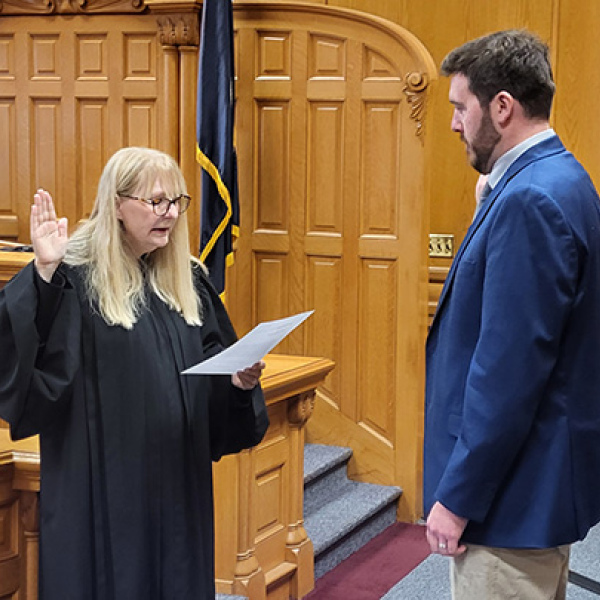 New Hamilton County Attorney Nathan Heinz of York is sworn in Thursday morning by District Judge Rachael Daughterty. In remarks after the swearing in, the judge noted that Heinz’s first hearing as a defense attorney had taken place before her in that very same courtroom. 