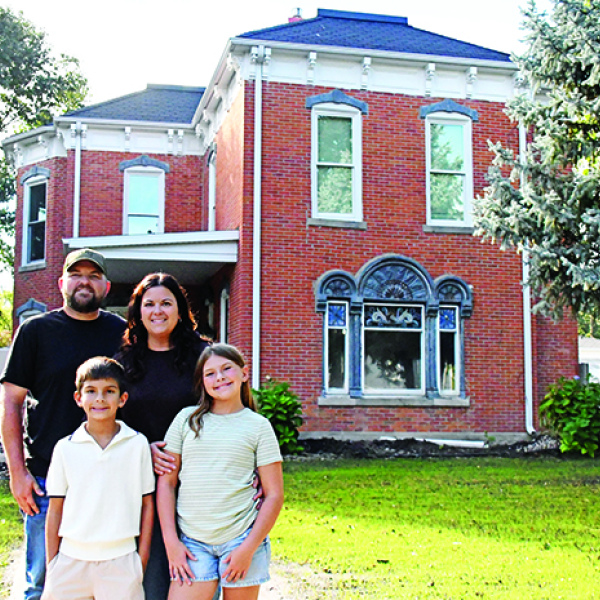 After five years of operating the Otto House as an Airbnb, Andrew and Taylor Willis decided to turn this historic house into their forever home. The couple is pictured in front of the newly restored house with their children, Ledger and Austyn.