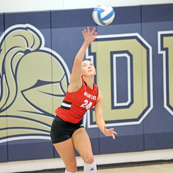 Baya Chamness puts up a serve during Aurora’s dramatic five-set victory at York Thursday. 