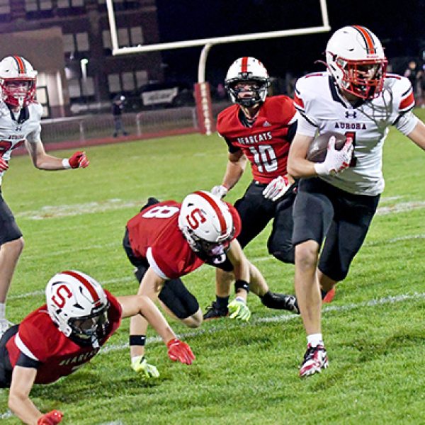 Landon Danhauer eludes multiple Scottsbluff defenders, scoring the game’s first touchdown in Aurora’s 24-21 loss to the Bearcats Friday. Danhauer caught two touchdowns in the game, totaling 77 yards. 