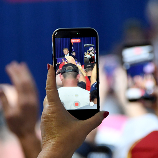A smart phone captures video of President Donald Trump as he leaves the platform in Grand Island Monday night