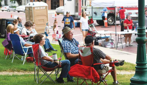 Bands on the Bricks spectators were asked to bring their own chairs and spread out for this year’s event, which debuted Friday with the first of six summer performances. News-Register/Kurt Johnson