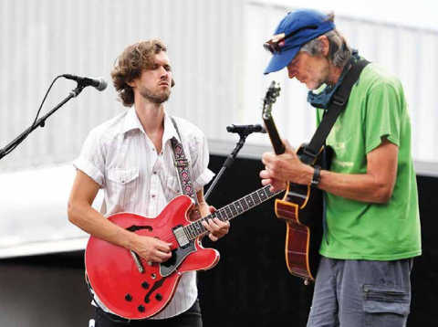 Myles Jasnowski, left, and Bill Whitney provided local musical talent during the Bands on the Bricks finale Friday night on the downtown square. News-Register/Kurt Johnson