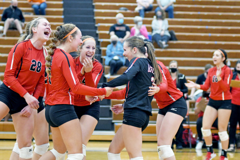 Aurora celebrates a rare attack from Cassidy Knust (3) during the Lady Huskies’ four set victory at Hastings Thursday. Aurora has won four straight heading into the Central Conference tournament. 