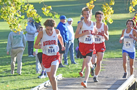 Lucas Gautier (left), Max Wiarda and Isaac Bisbee keep their pace during the C-4 District Meet. All three runners finished within 10 seconds of each other.