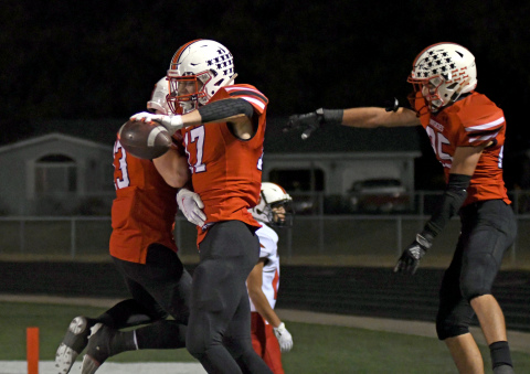 Mitchell Pachta celebrates with his teammates after one of his two touchdowns in a 54-3 win over Scottsbluff Friday night. 