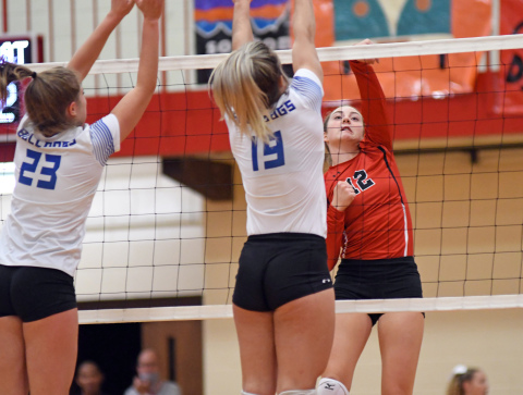 Rachel Hunter records an attack during a four-set loss to North Platte Thursday. 