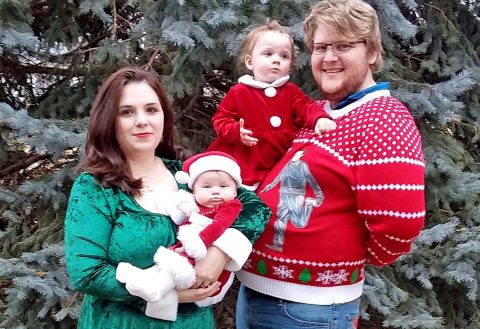 Sylvia Painter stand with her husband Brendon, daughters Morgan and Felicity and their “store mascot” Trigger.