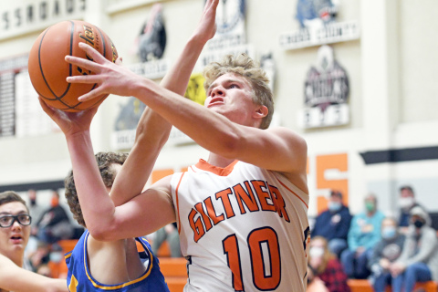 Landyn Davidson drives the lane and fights through heavy contact in the second half of Giltner’s 40-37 win aginast Nebraska Lutheran Dec. 15. 