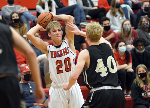 Aurora's Mitchell Pachta fires a jump pass cross court during Aurora's 52-30 win against GINW. 