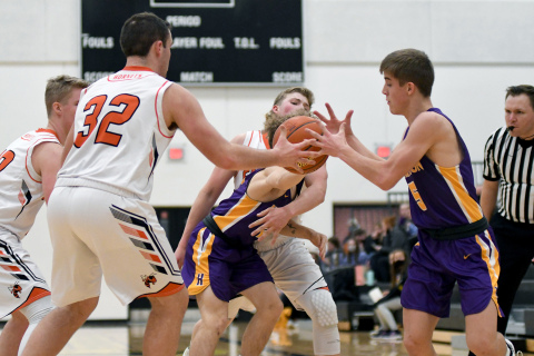 A fight for the ball ensues with Giltner’s Jacob Smith (32) and Hampton’s Drake Schafer (5) with others in pursuit.
